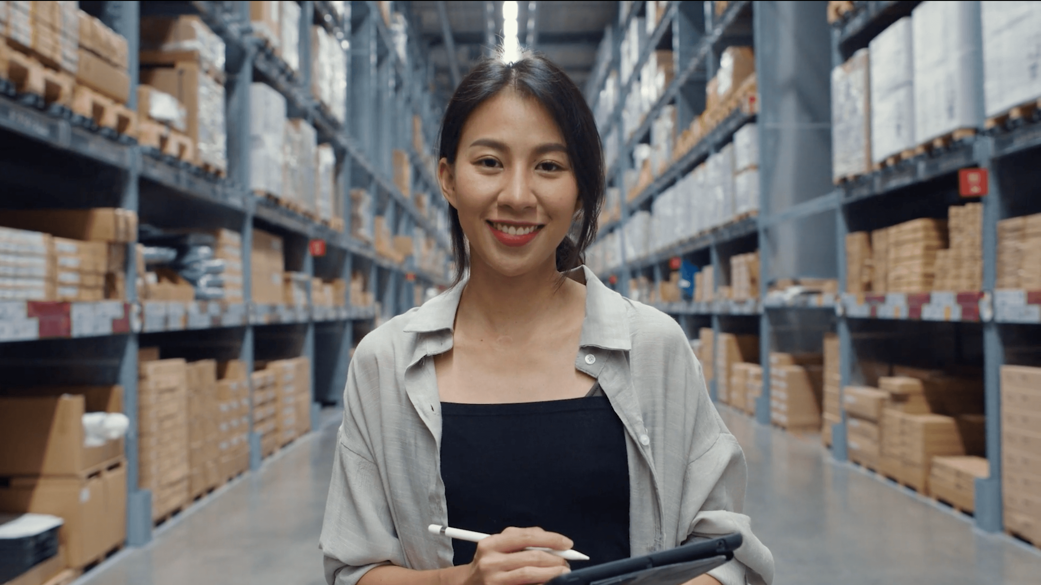 Finance team member reviewing inventory on a tablet